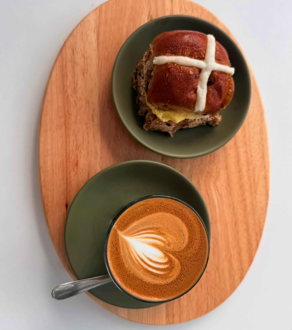 Latte and hot cross bun served at Coffee Ministry