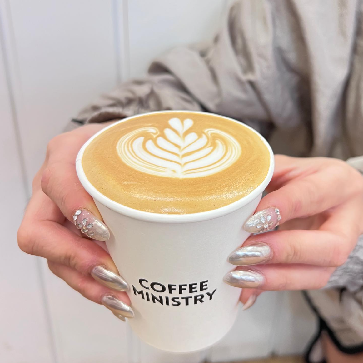 Coffee Ministry takeaway latte with detailed latte art
