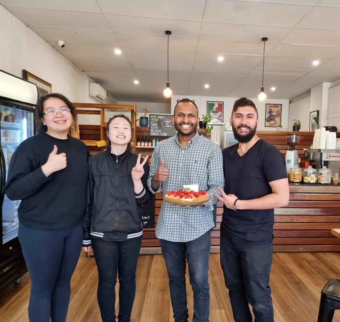 Coffee Ministry team celebrating together in the café